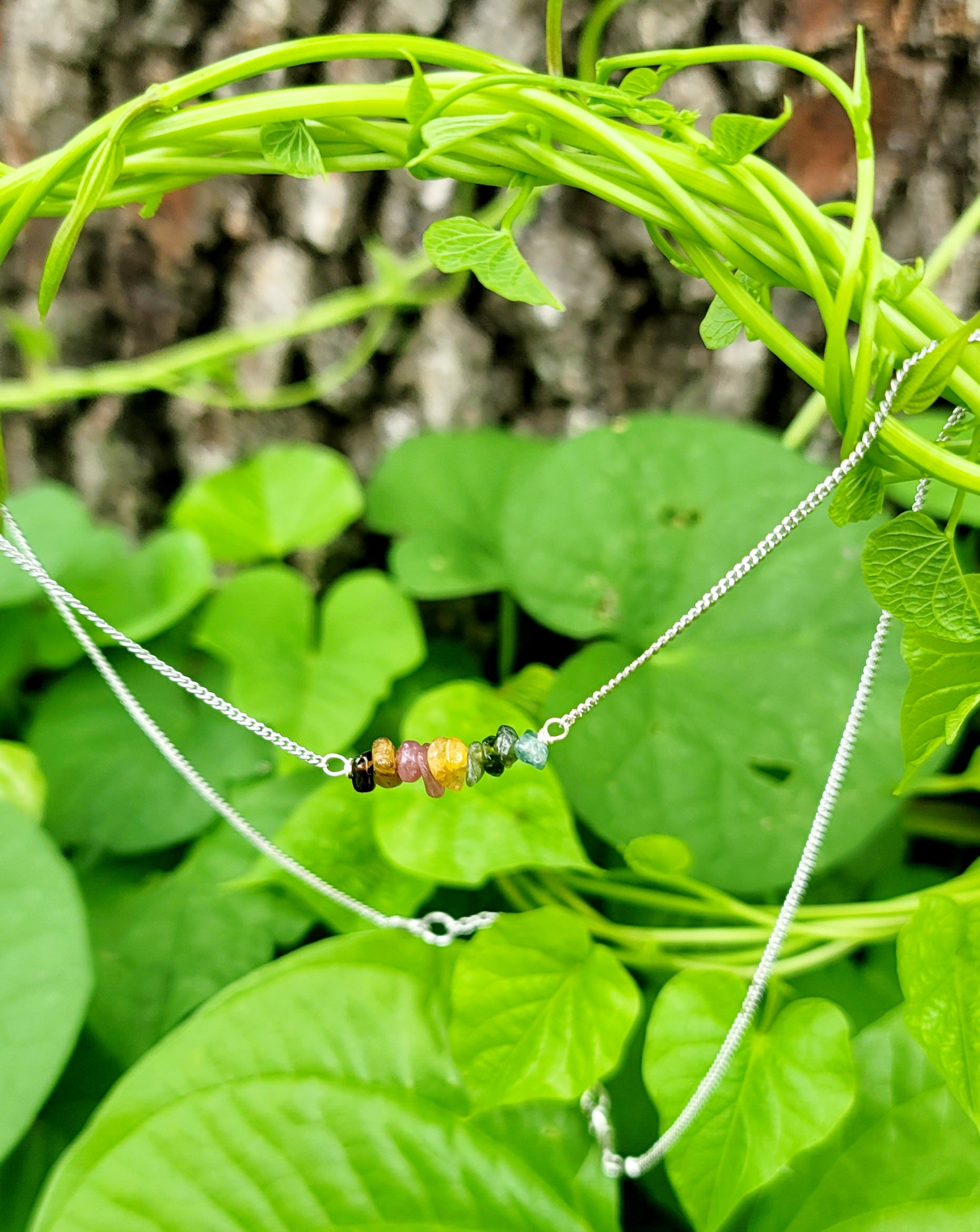 Minimalist Rainbow Tourmaline necklace featured in silver color petite chain.